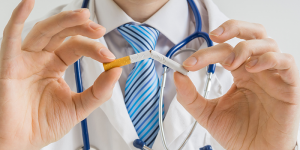 doctor breaking a cigarette